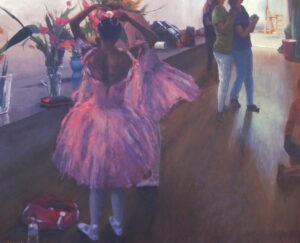 Ballerinas in pink tutus fixing their hair