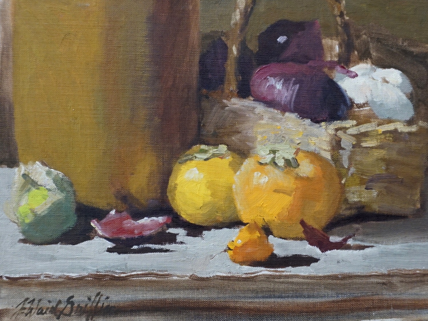 Persimmons, onions, garlic, and a basket on a shelf