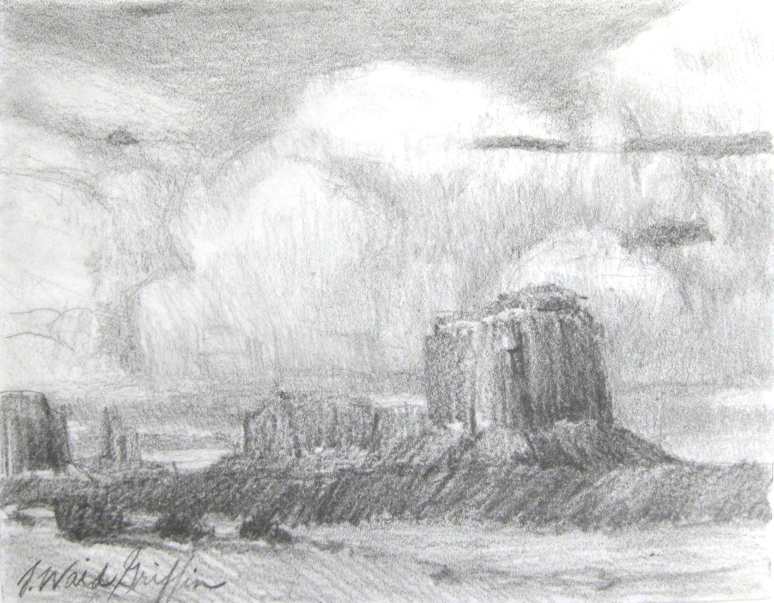 sandstone mesas and clouds